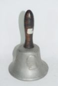 A bell, decorated in relief with busts of Churchill, Roosevelt and Stalin