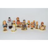 Collection of nine various Goebel/Hummel models of children and a further porcelain figure of a lady