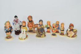 Collection of nine various Goebel/Hummel models of children and a further porcelain figure of a lady