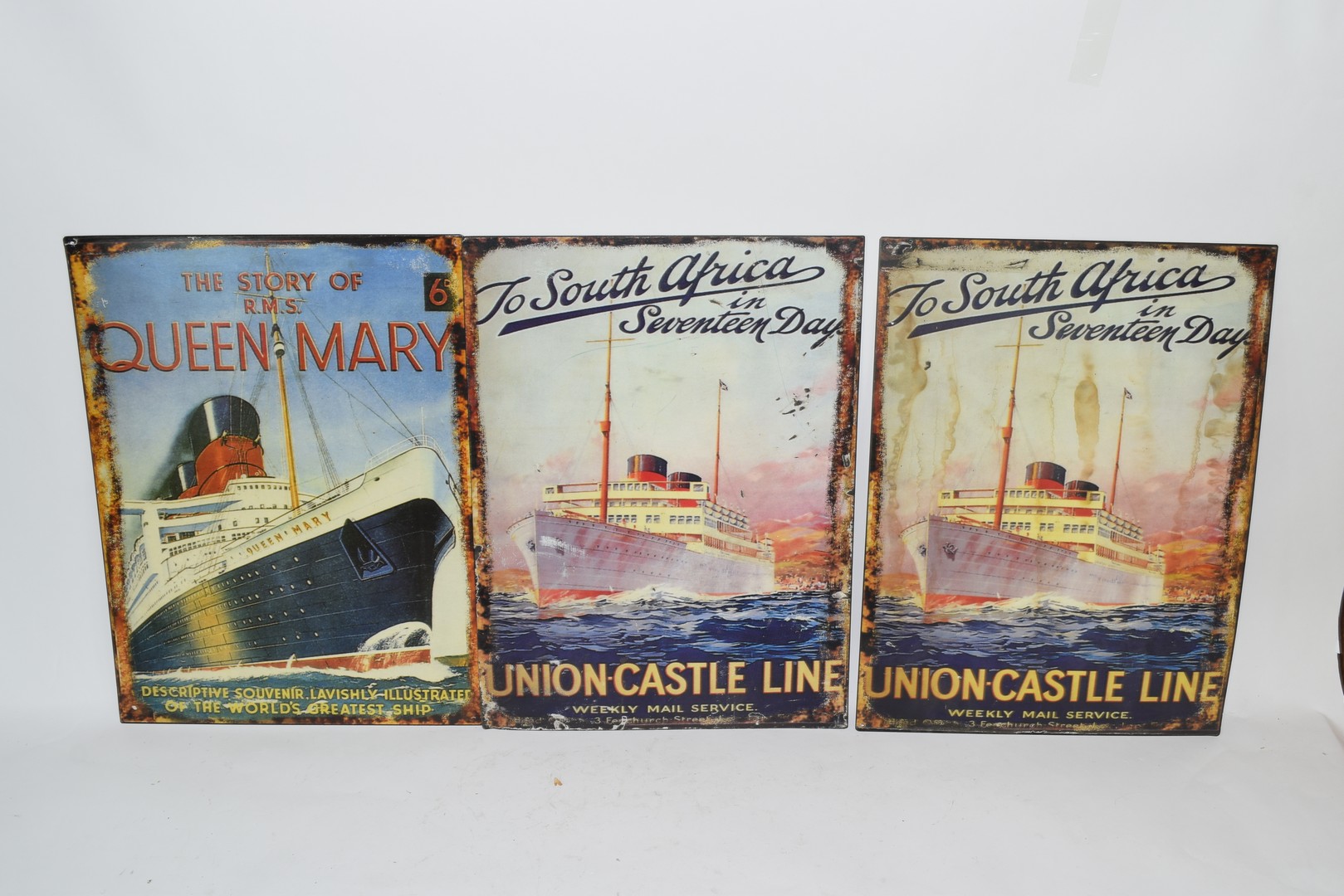 Three enamel reproduction posters