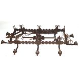 20th century iron ten-branch light fitting, the rectangular centre with floral decoration and
