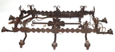 20th century iron ten-branch light fitting, the rectangular centre with floral decoration and