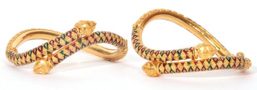 A pair of Indian high-grade yellow metal & enamel serpent bangles, a design featuring two entwined