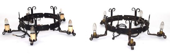 Pair of 20th century cast iron five-light ceiling light fittings, with circular centres and scrolled