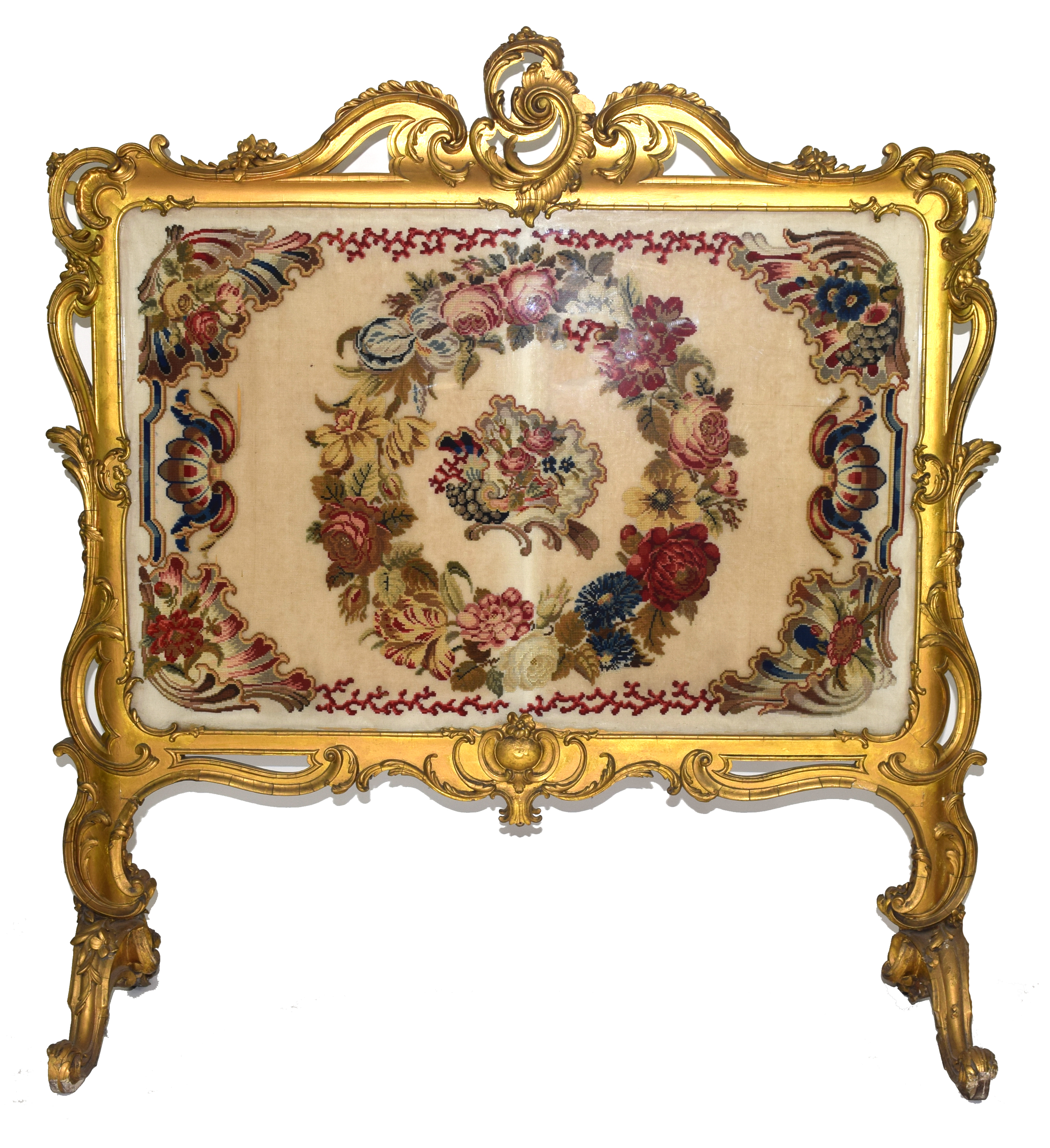 Large gilt gesso framed fire screen, the frame with elaborate foliate and scrolled detail, the