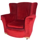 Early 20th century armchair, red upholstery with loose seat cushion, set on casters, 83cm high
