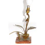 Small gilt metal and marble based table lamp formed as a boy pulling a cart containing a large