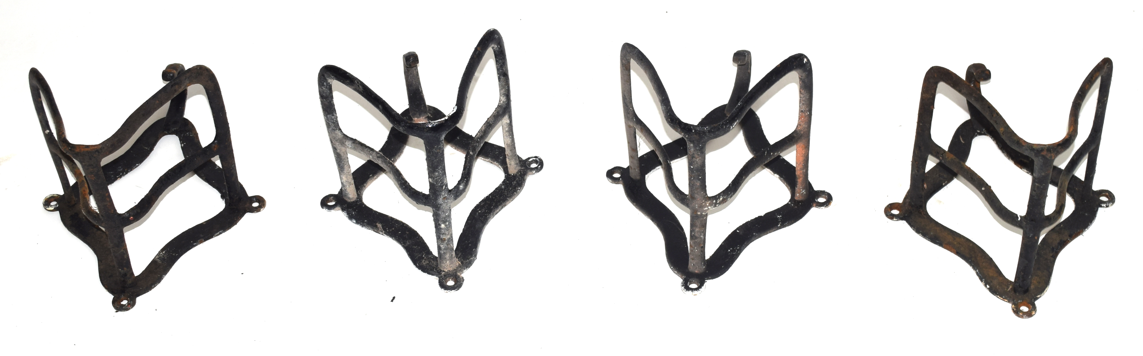 Four Victorian iron saddle racks, approx 30cm high