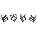 Four Victorian iron saddle racks, approx 30cm high