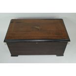 19th century walnut cased musical box, the inlaid lid enclosing a cylinder movement of 8 airs with