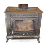 20th century cast iron wood burning stove by Sunrain, with glazed single door, 70cm high max