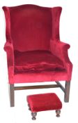 20th century wing back armchair in the Georgian style, upholstered in red fabric, with hardwood