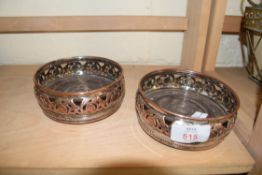 PAIR OF SILVER PLATE ON COPPER BOTTLE STANDS