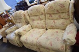 FLORAL UPHOLSTERED TWO-SEATER SOFA AND MATCHING ARMCHAIR