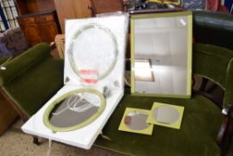 COLLECTION OF RETRO STYLE WALL MIRRORS IN GREEN PLASTIC FRAMES COMPRISING TWO CIRCULAR EXAMPLES, TWO