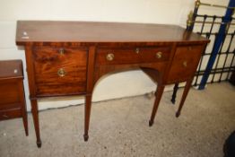 EDWARDIAN MAHOGANY BOW FRONT SIDEBOARD WITH TWO DRAWERS AND ONE DOOR RAISED ON TAPERING LEGS WITH