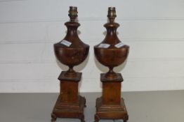 PAIR OF PAINTED METAL TABLE LAMP BASES FORMED AS VASES ON PEDESTALS