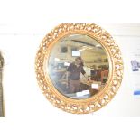 20TH CENTURY CIRCULAR GILT FRAMED WALL MIRROR, FRAME WITH FOLIATE DECORATION, 53CM DIAM