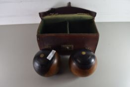 LEATHER CASE CONTAINING TWO LAWN BOWLS