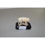 SMALL ANTIQUE IVORY MODEL OF A DOG SET ON WOODEN PLINTH BASE