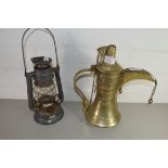 OMANI BRASS COFFEE POT TOGETHER WITH A STORM LANTERN