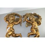 TWO MODERN GILT FINISH CHERUB WALL DECORATIONS