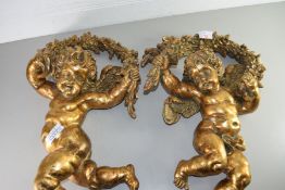 TWO MODERN GILT FINISH CHERUB WALL DECORATIONS