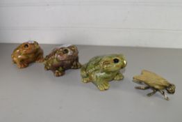 MIXED LOT COMPRISING A BRASS MODEL FLY, THREE POTTERY MODEL TOADS (4)