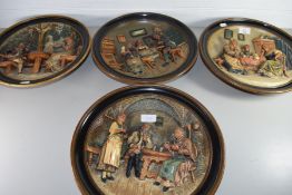 SET OF FOUR MUSTERSCHUTZ 3D PLATE FORMED WALL PLAQUES DECORATED WITH VARIOUS FIGURES
