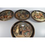 SET OF FOUR MUSTERSCHUTZ 3D PLATE FORMED WALL PLAQUES DECORATED WITH VARIOUS FIGURES