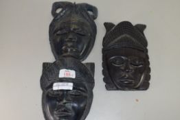 PAIR OF AFRICAN HARDWOOD CARVED MASKS TOGETHER WITH ONE OTHER
