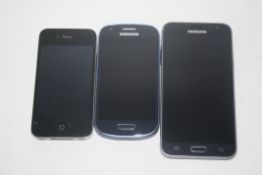 I-phone and a pair of Samsung phones