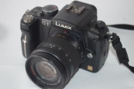 Panasonic Lumix DMCG1 with Lumix 14-15 lens, and Lumix 145-175 lens plus charger and case
