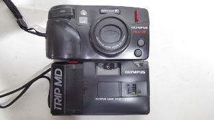 Olympus Superzoom 110 film camera together with an Olympus Trip ND