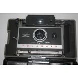 Polaroid automatic 340 land camera together with additional Polaroid land camera and another