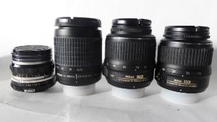 Nikon 18-55mm lens together with Nikkor 28-100mm lens, Nikkor 18-55mm lens and Nikkor-H50mm lens