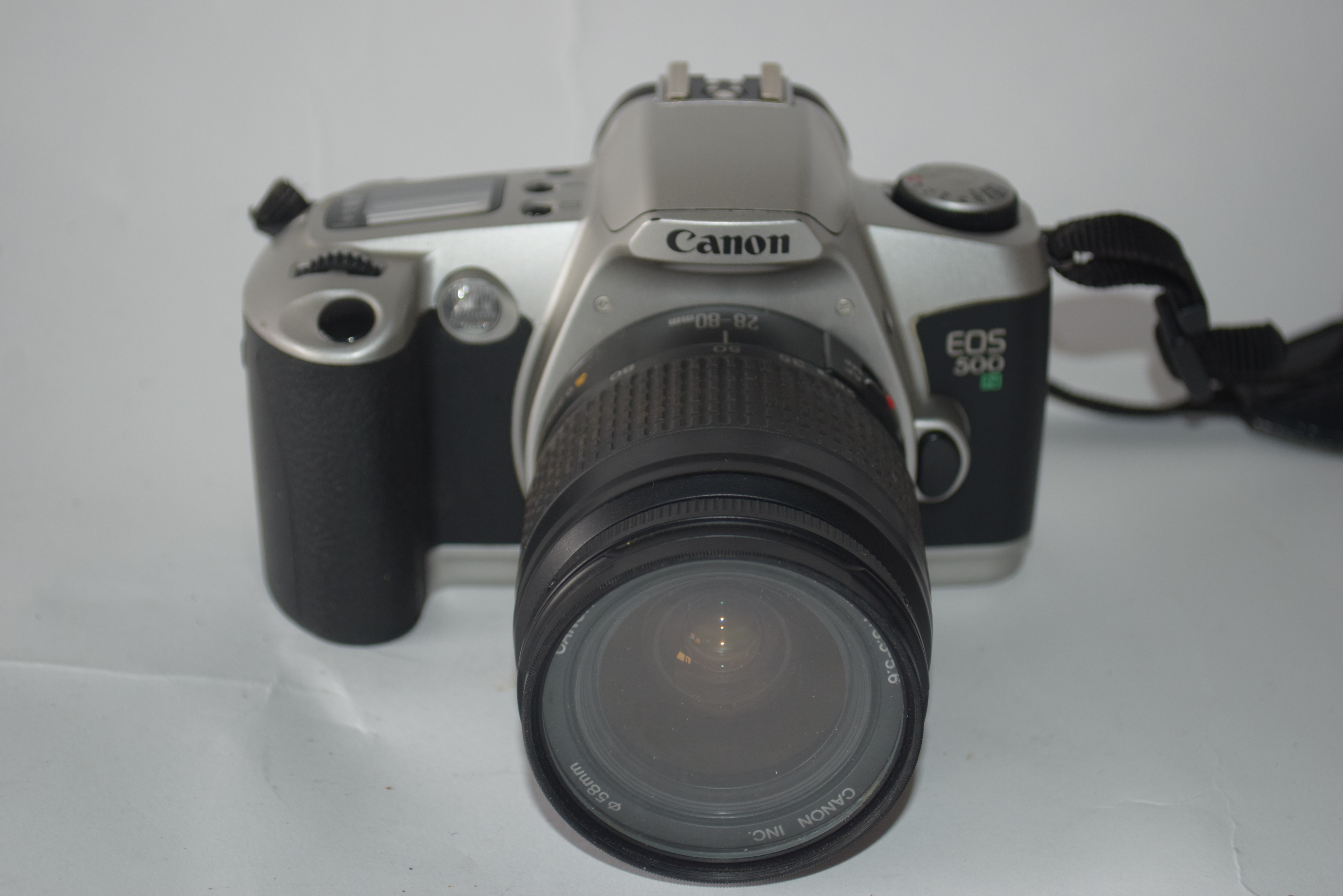 Canon EOS 500N film camera with manual and case together with Canon zoom lens EF28-80mm