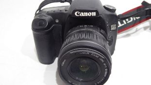 Canon EOS 30D together with Canon zoom lens 18-55mm, Pentax-A 50mm lens and charger