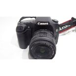 Canon EOS 30D together with Canon zoom lens 18-55mm, Pentax-A 50mm lens and charger