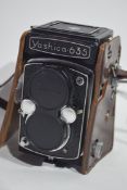 Yashica-635 35mm film camera together with manual, slide, copier, Prinzflex 3 x autoconverter and