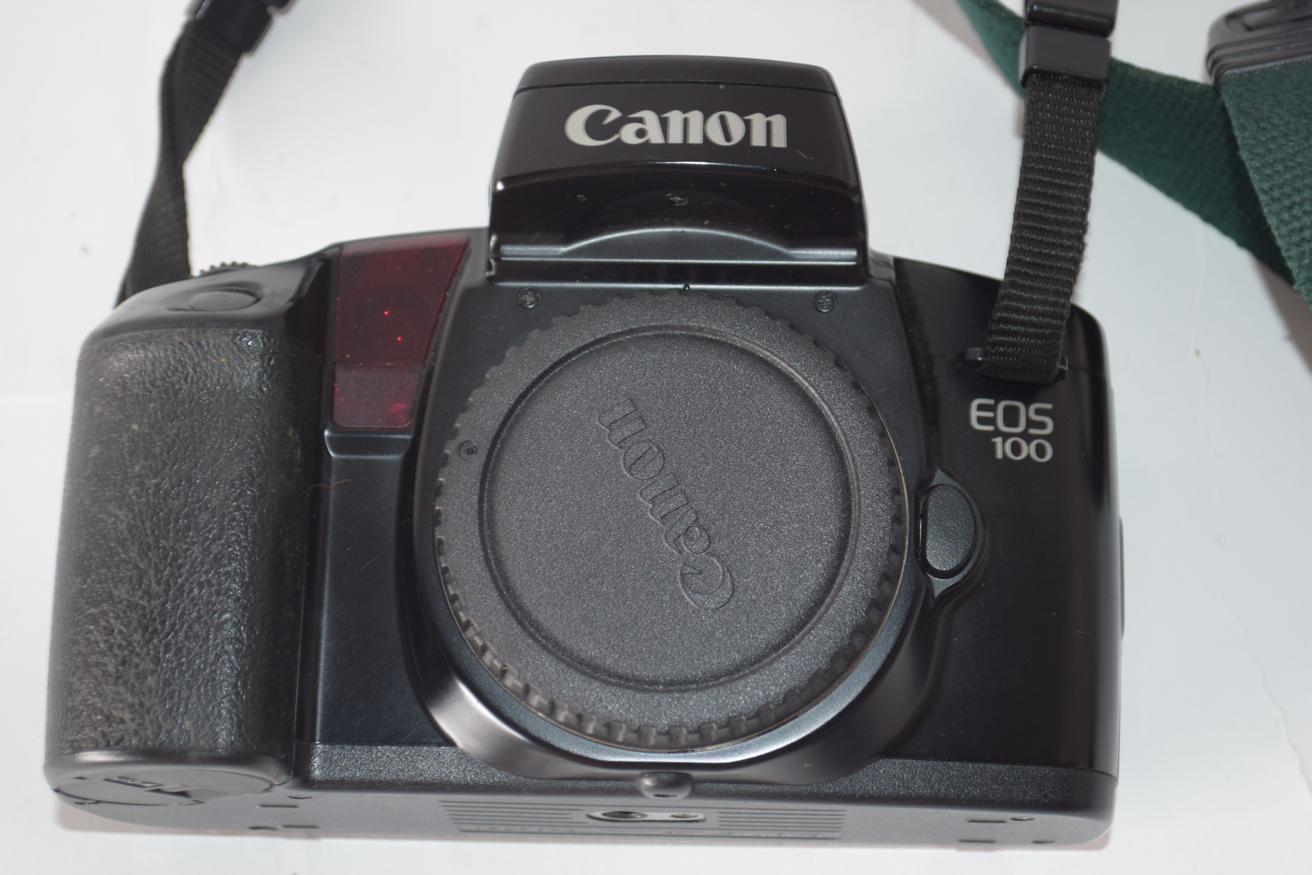 Canon EOS100 film camera together with Canon zoom lens EF28-105mm and case