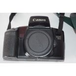 Canon EOS100 film camera together with Canon zoom lens EF28-105mm and case