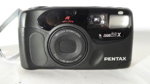 Pentax Zoom 60-X together with case and manual