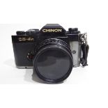 Chinon CE-4S film camera together with Ensinor autozoom 80-200mm lens and case