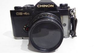 Chinon CE-4S film camera together with Ensinor autozoom 80-200mm lens and case