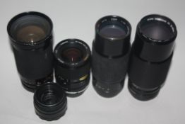 Canon zoom lens FD 70-210mm together with a Sirius MC228-200mm lens, a Tamron 28-70mm lens and a