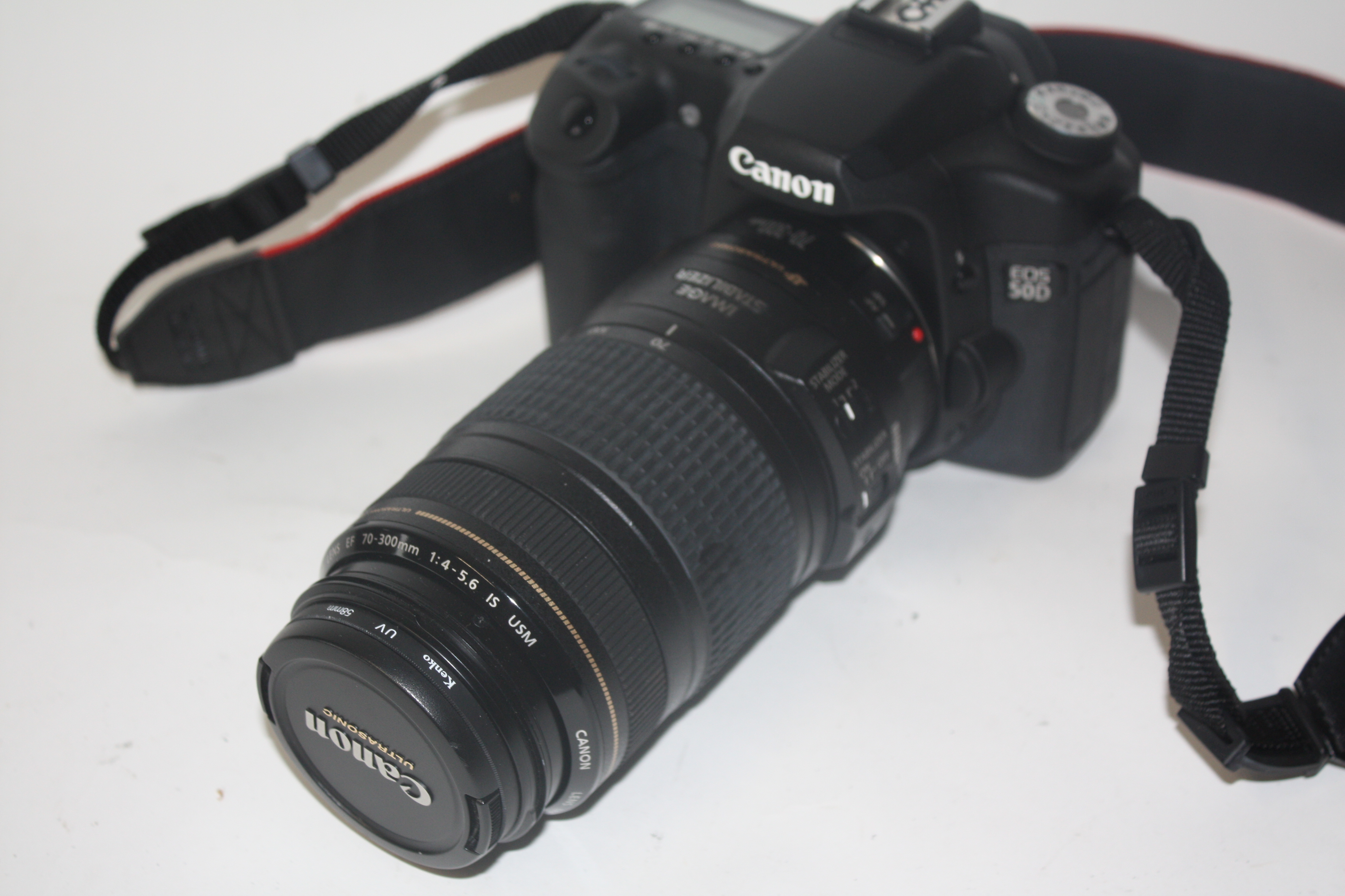 Canon EOS 50D digital camera together with Canon zoom lens EF70-300mm