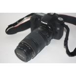 Canon EOS 50D digital camera together with Canon zoom lens EF70-300mm