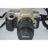 Nikon F60 film camera with film loaded, together with a Nikon AF Nikkor 35-80mm lens, manual and