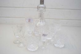 MIXED LOT OF CLEAR CUT GLASS DRINKING GLASSES AND A FURTHER DECANTER